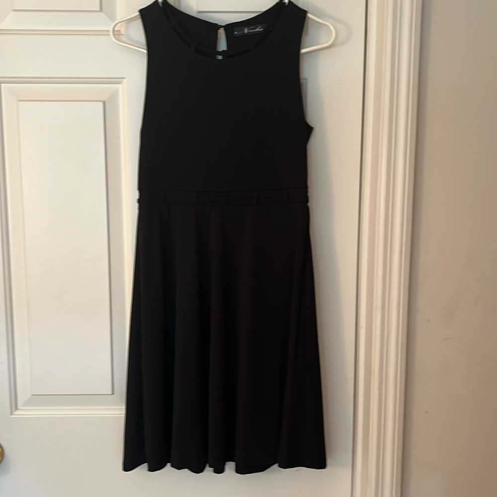 Neesha, size small, black dress.